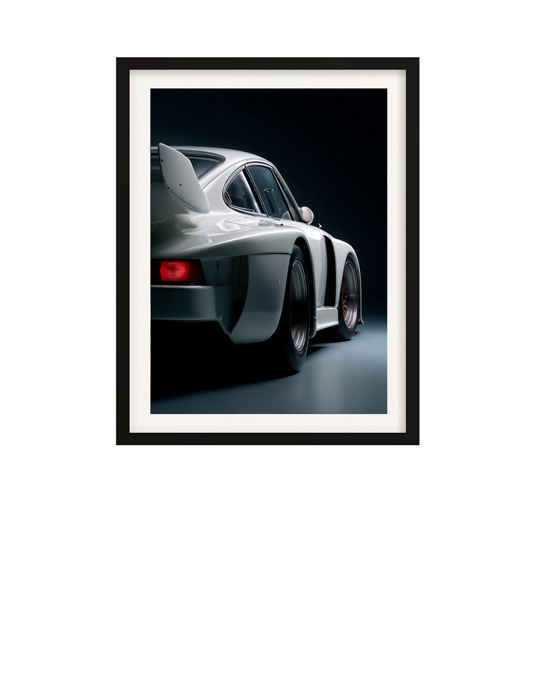 Framed photograph of a white 1980 Porsche 935 sports car on a black background