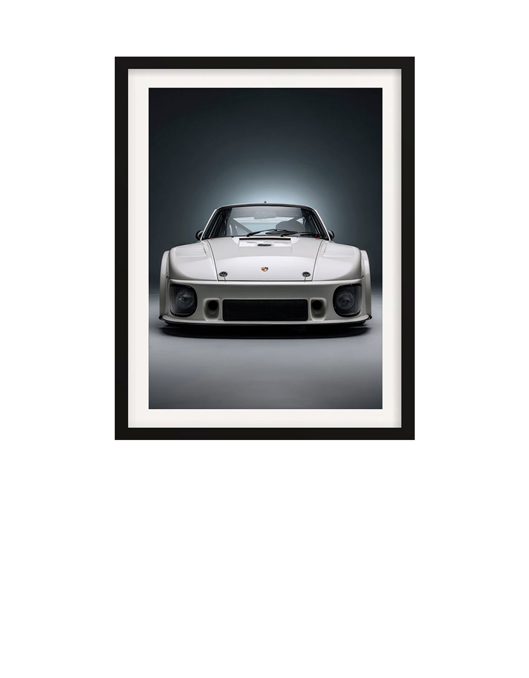 Framed black and white photograph of a classic 1980 Porsche 935 car on a dark background