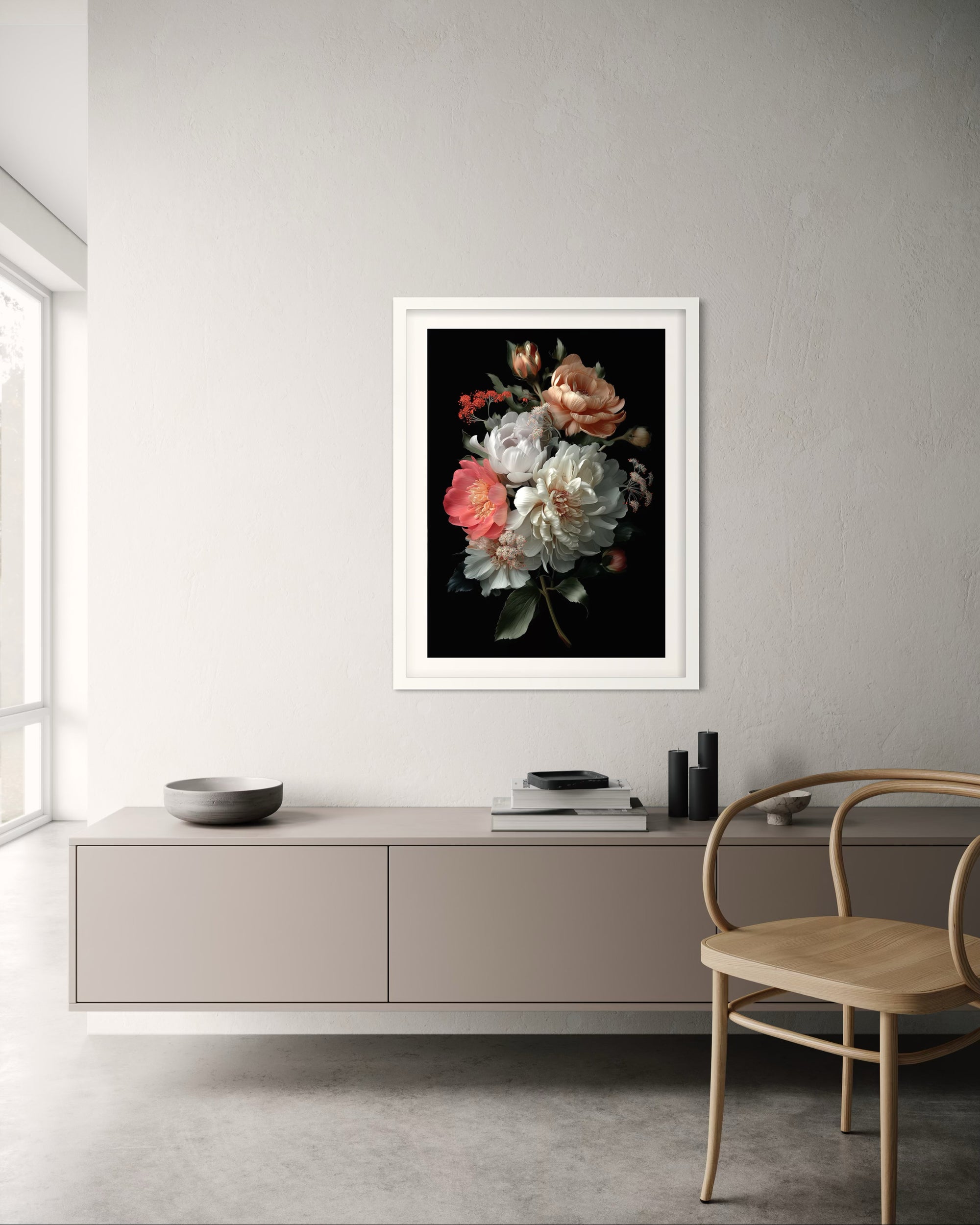Framed floral artwork on a wall above a modern cabinet with a chair.