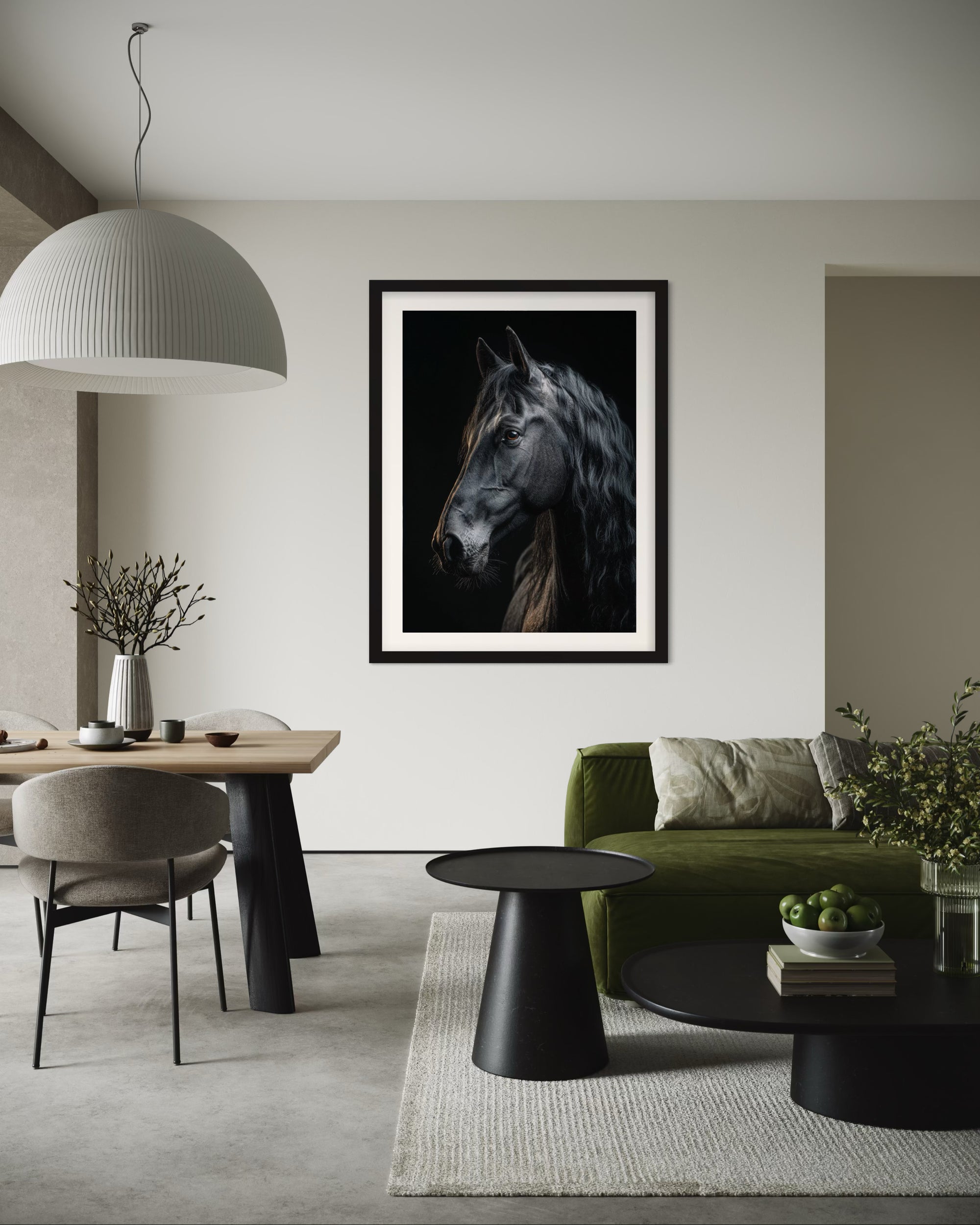 Living room with a framed black stallion horse portrait on the wall, green sofa, and modern decor.