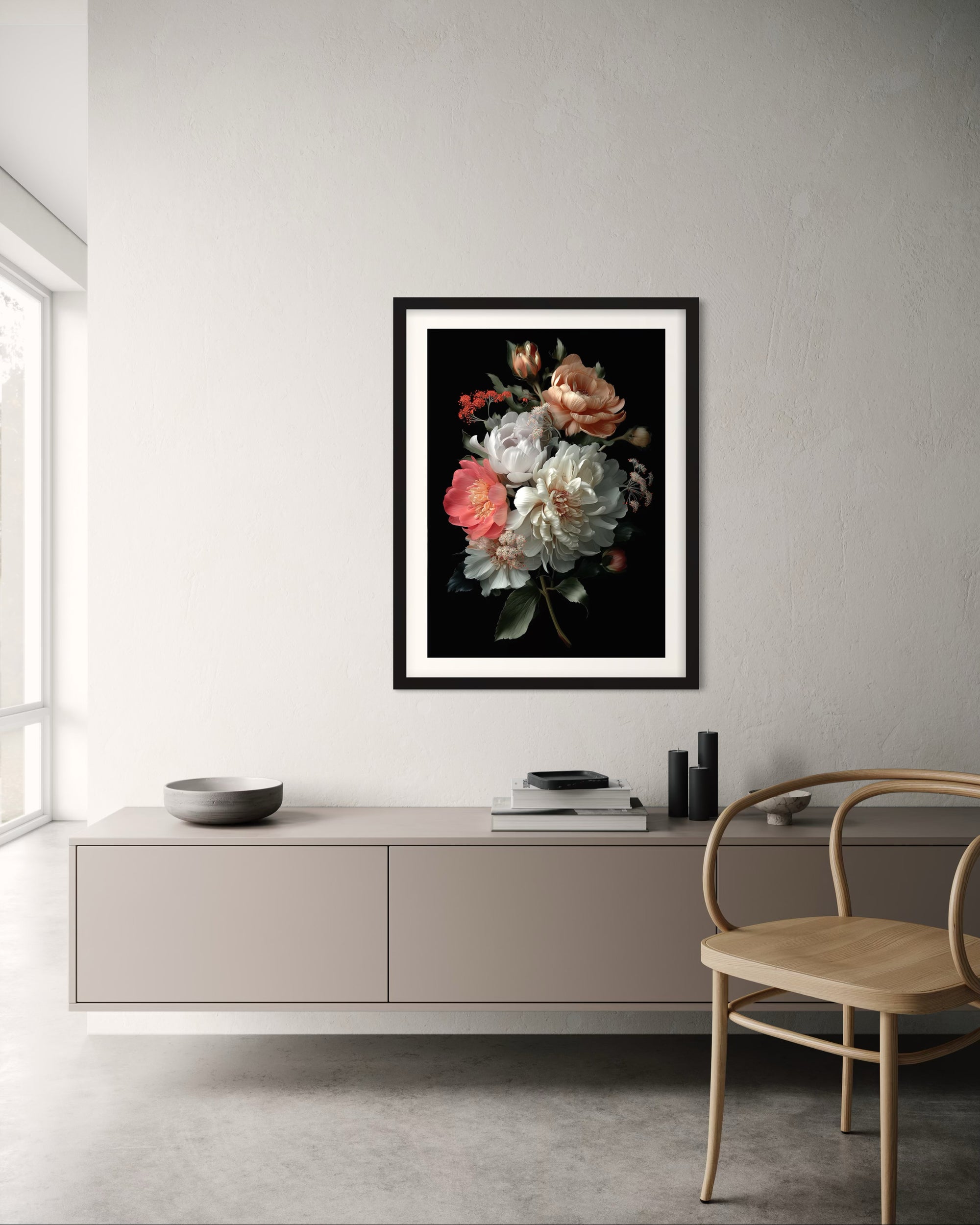 Framed floral artwork on a wall above a modern cabinet with a chair.